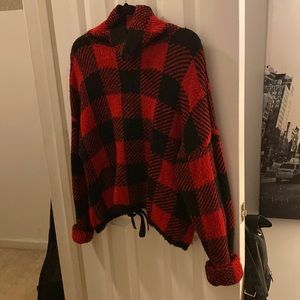 Warm black and red plaid sweater.